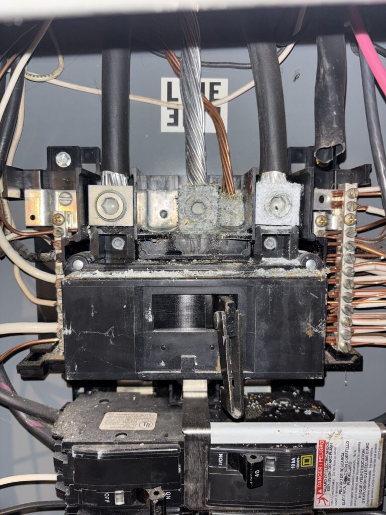 Corroded main breaker lug repaired by licensed electrician Gray ME