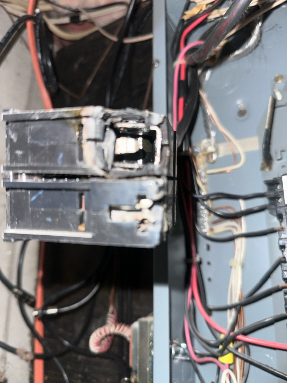 Melted circuit breaker discovered during electrical troubleshooting in Maine