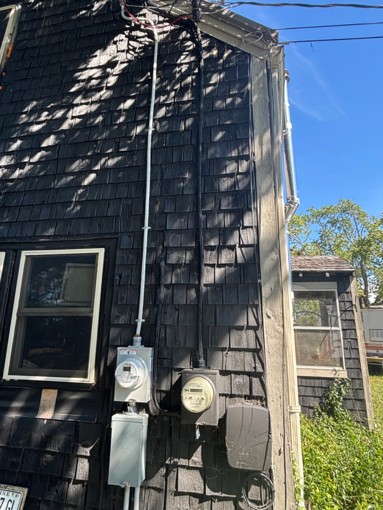 100 amp electrical service with exterior meter and disconnect installed on residential home in Maine