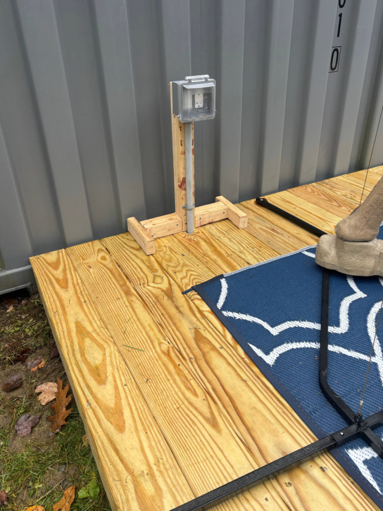 Outdoor electrical outlet installation on deck in Maine for weather-resistant power access Electrician Cumberland ME