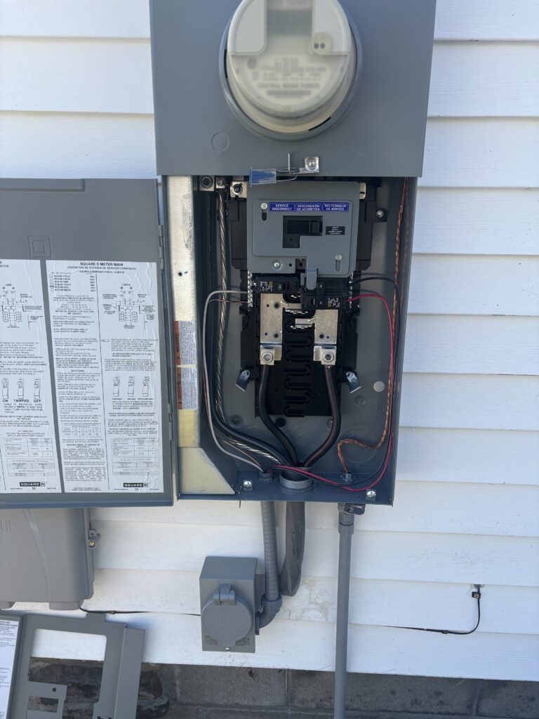 Electrician Falmouth ME installing generator interlock kit and PB30 power inlet